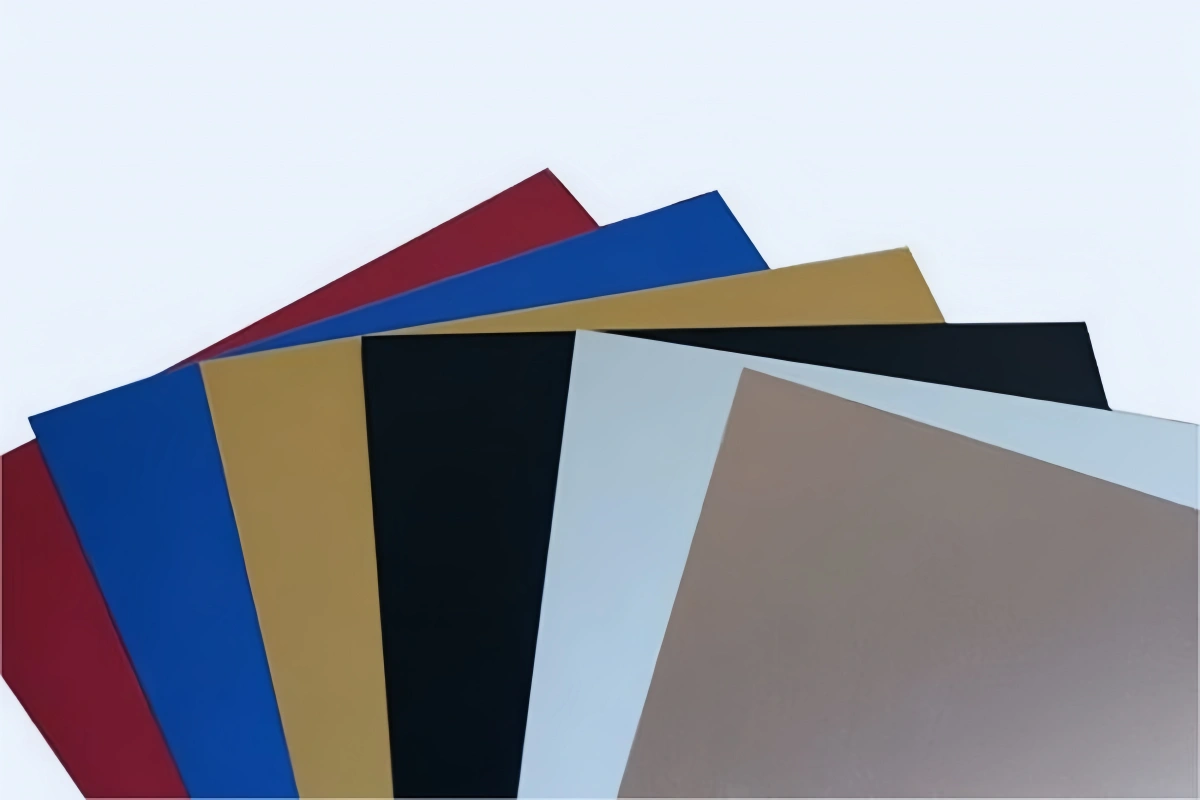 Factory worker inspecting an anodized aluminum plate